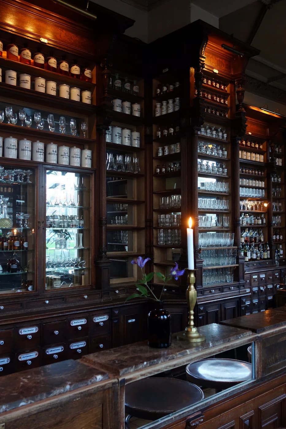 Historic pharmacy cabinetry inside ORA at Oranienplatz 14, archival photograph