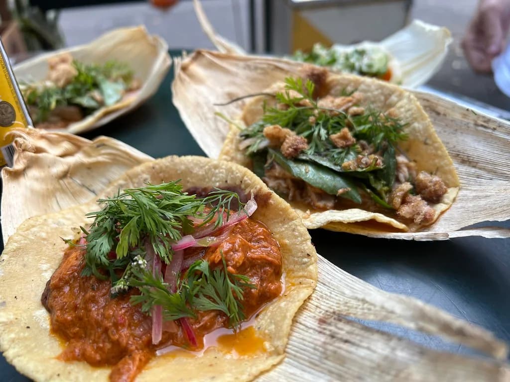 Tacos served on corn husks at Cariñito Tacos in Roma Norte, photographed in November 2024