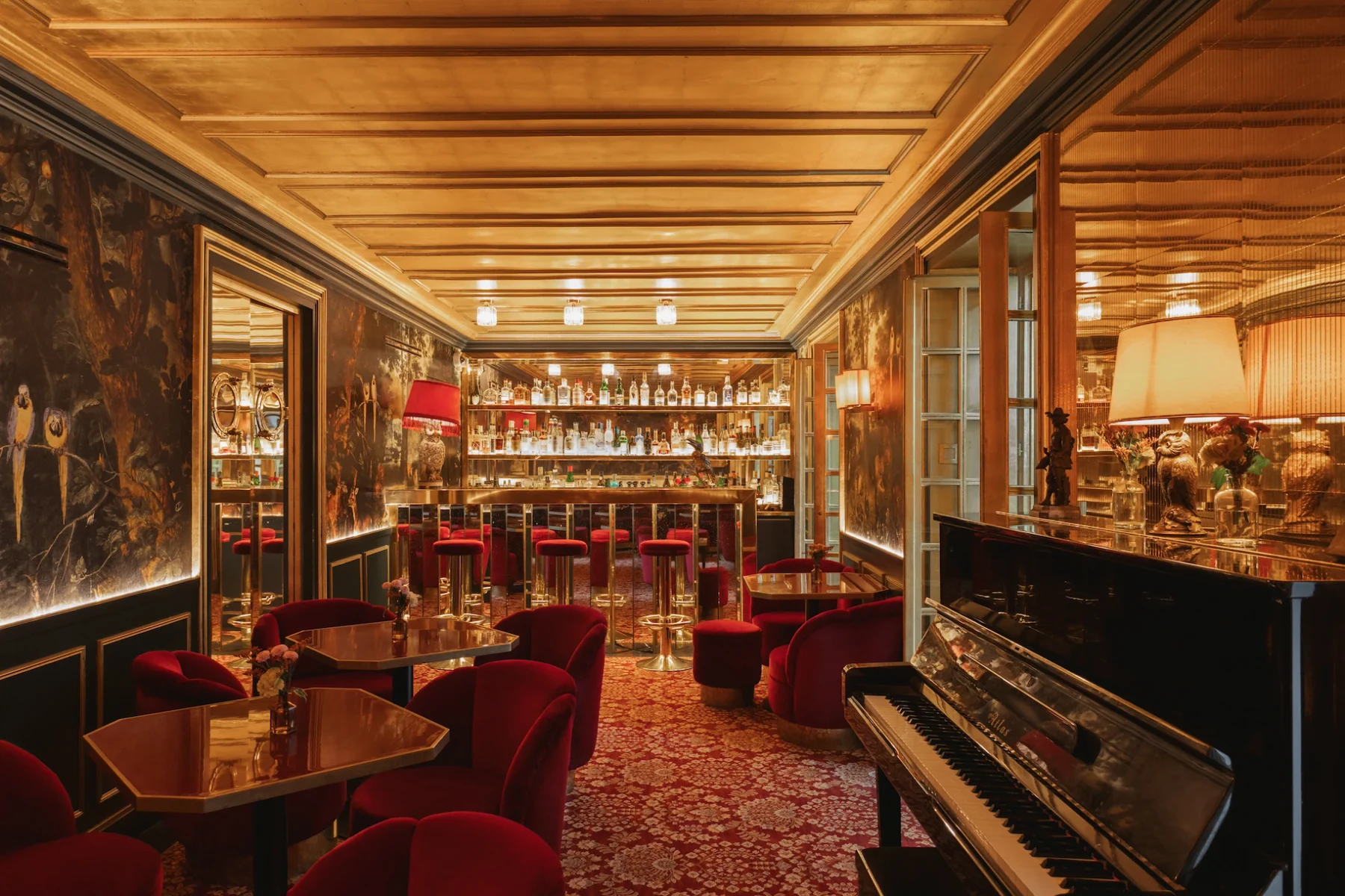 Red velvet seats, a gold-toned ceiling and a piano at Le Très Particulier.