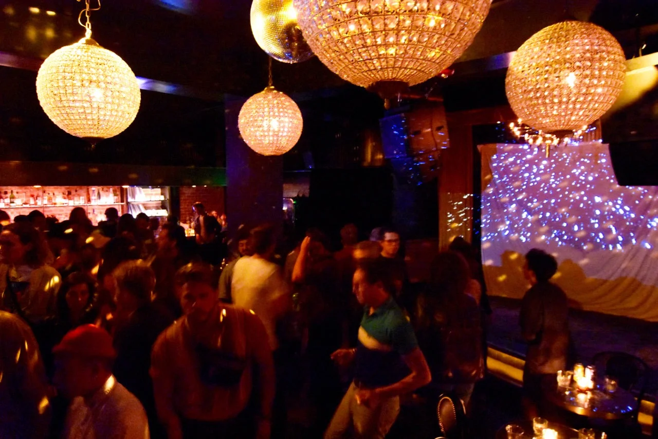 Dancers beneath the disco balls at Gold-Diggers in Los Angeles