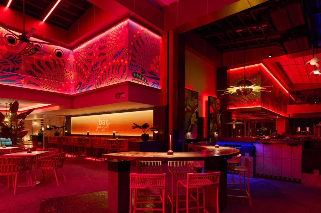 The bar counter under red lighting at Bar.Yard