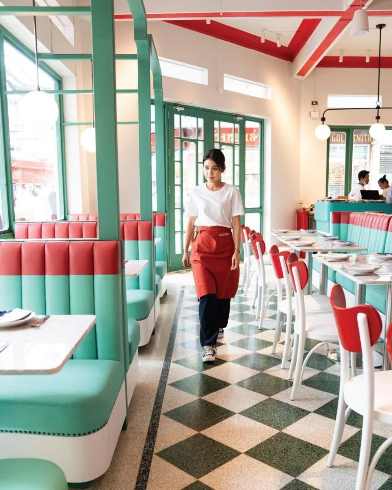 Green booths, red chairs and a tiled dining room at Chop Chop Cook Shop