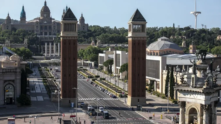 The avenue's Venetian towers with Montjuïc beyond at Avinguda de la Reina Maria Cristina