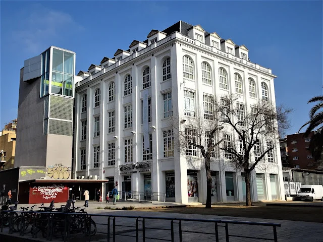 Centre Cívic Can Felipa: the cultural centre's white facade beside its glass entrance tower