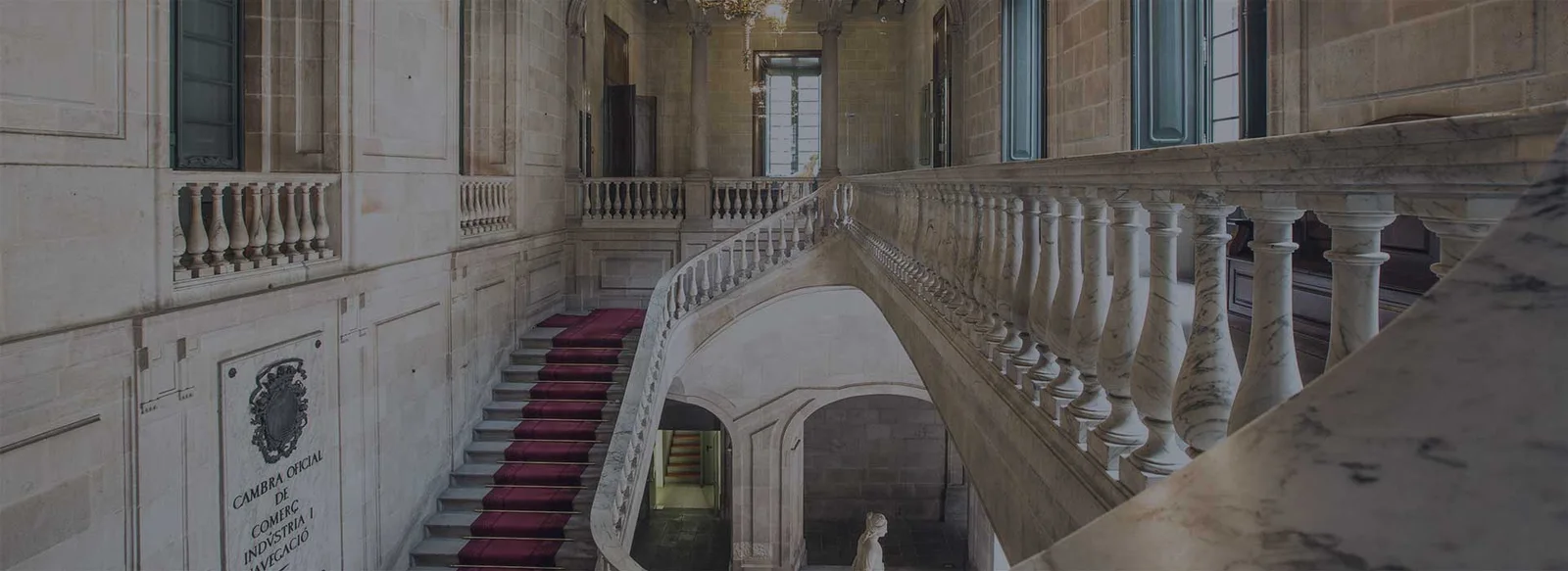 The stone staircase and courtyard at Casa Llotja de Mar