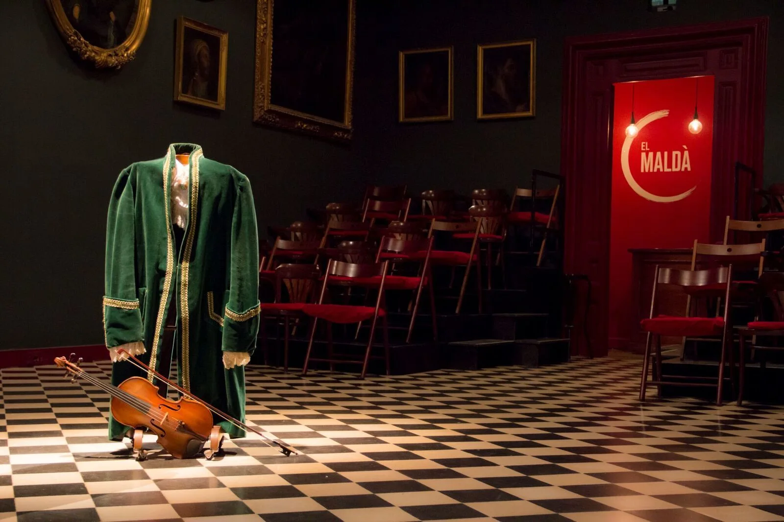 El Maldà: the intimate theatre's chequered stage floor and red entrance door