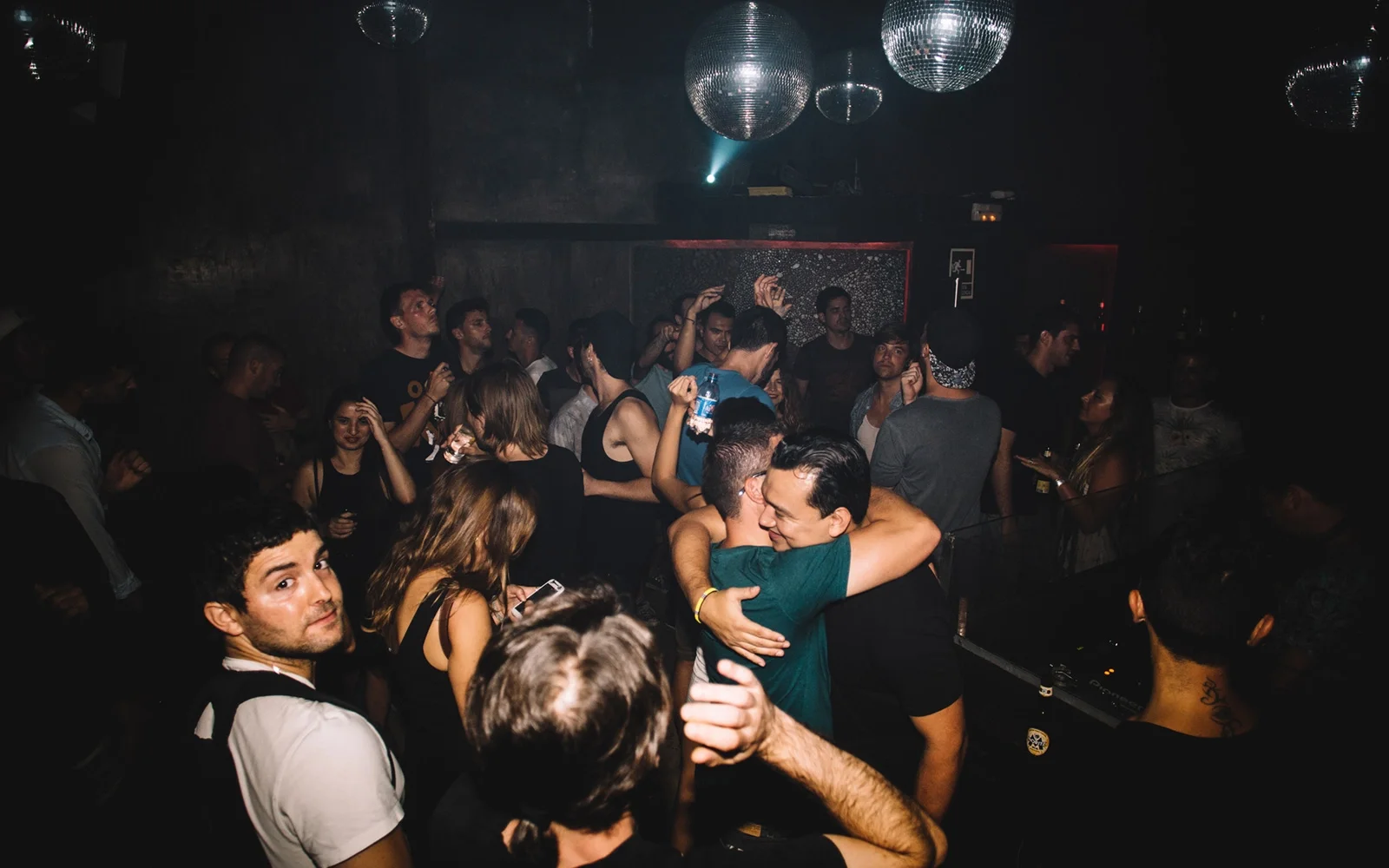 Dancing beneath disco balls at Macarena Club, Barcelona