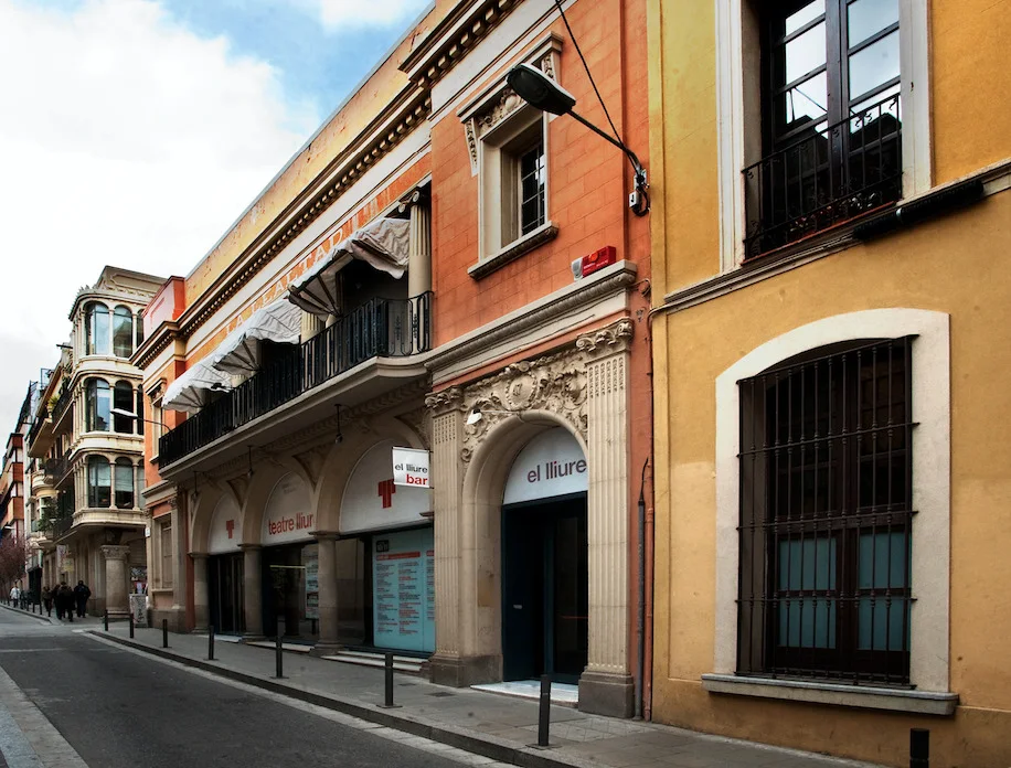 Teatre Lliure Gràcia: the theatre's warm-coloured facade along the Gràcia street