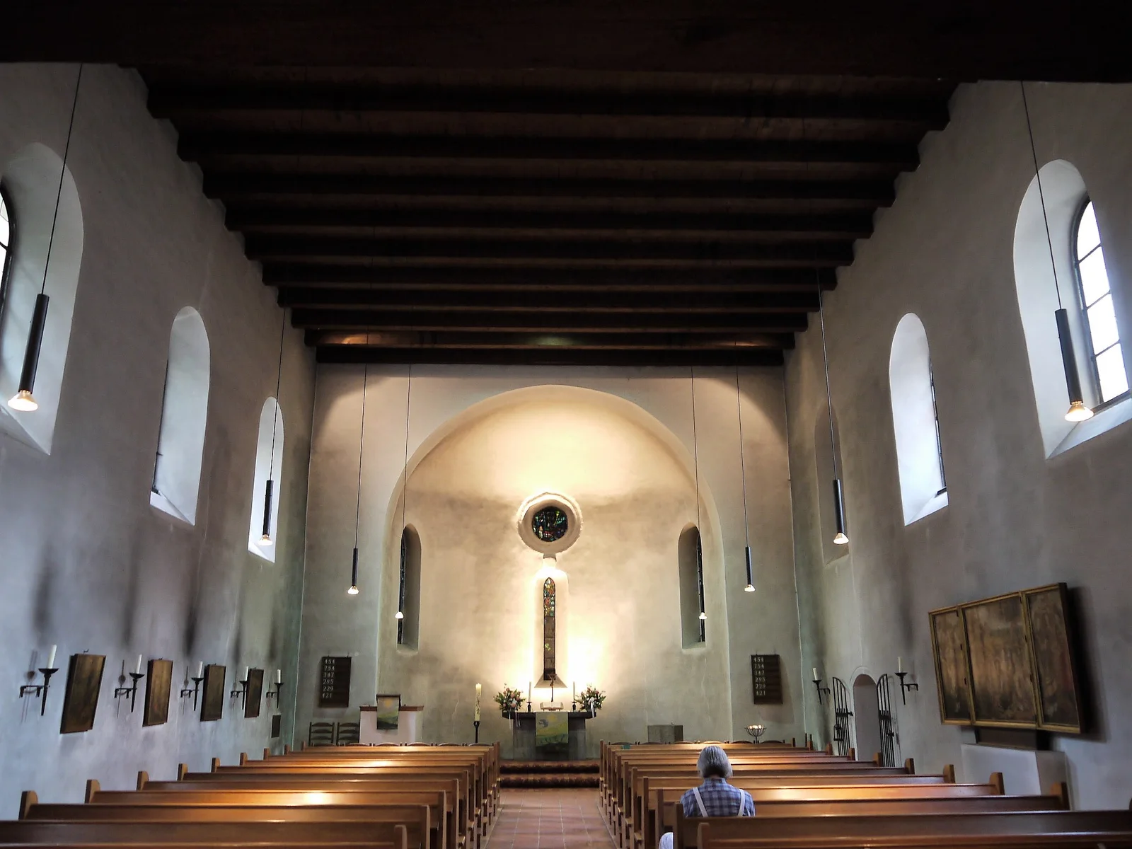 Dorfkirche Tempelhof: the church's white-walled nave beneath a dark timber ceiling