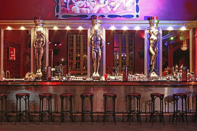 Insomnia: the ornate club bar with mirrored panels and warm lighting
