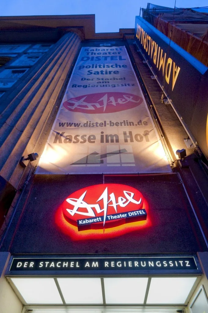Kabarett-Theater Distel: the illuminated theatre entrance and vertical sign