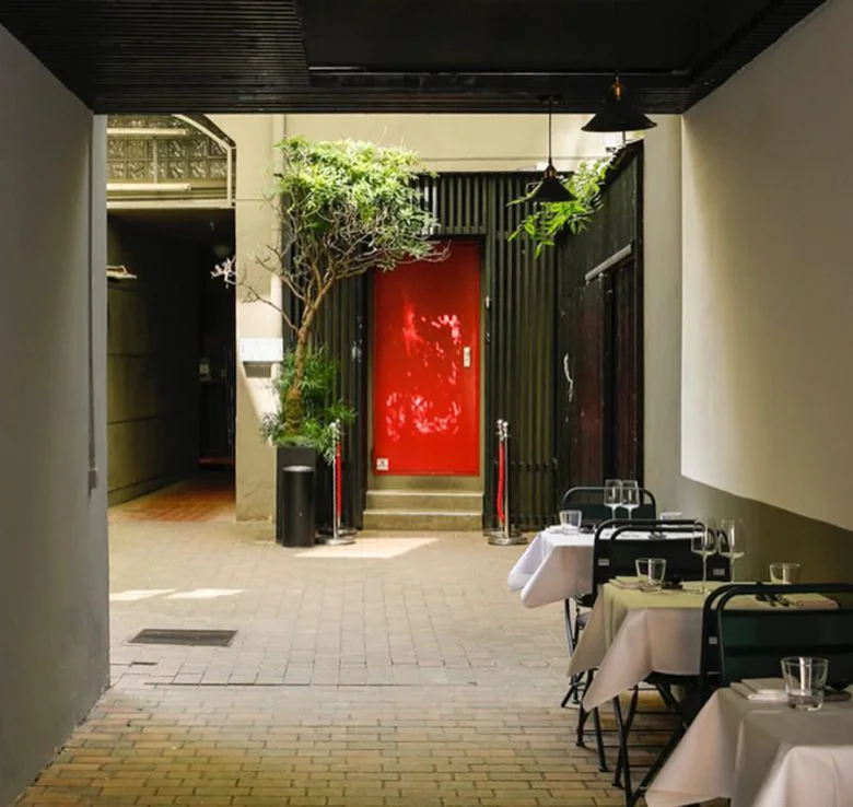 The restaurant entrance and softly lit corridor at Oukan
