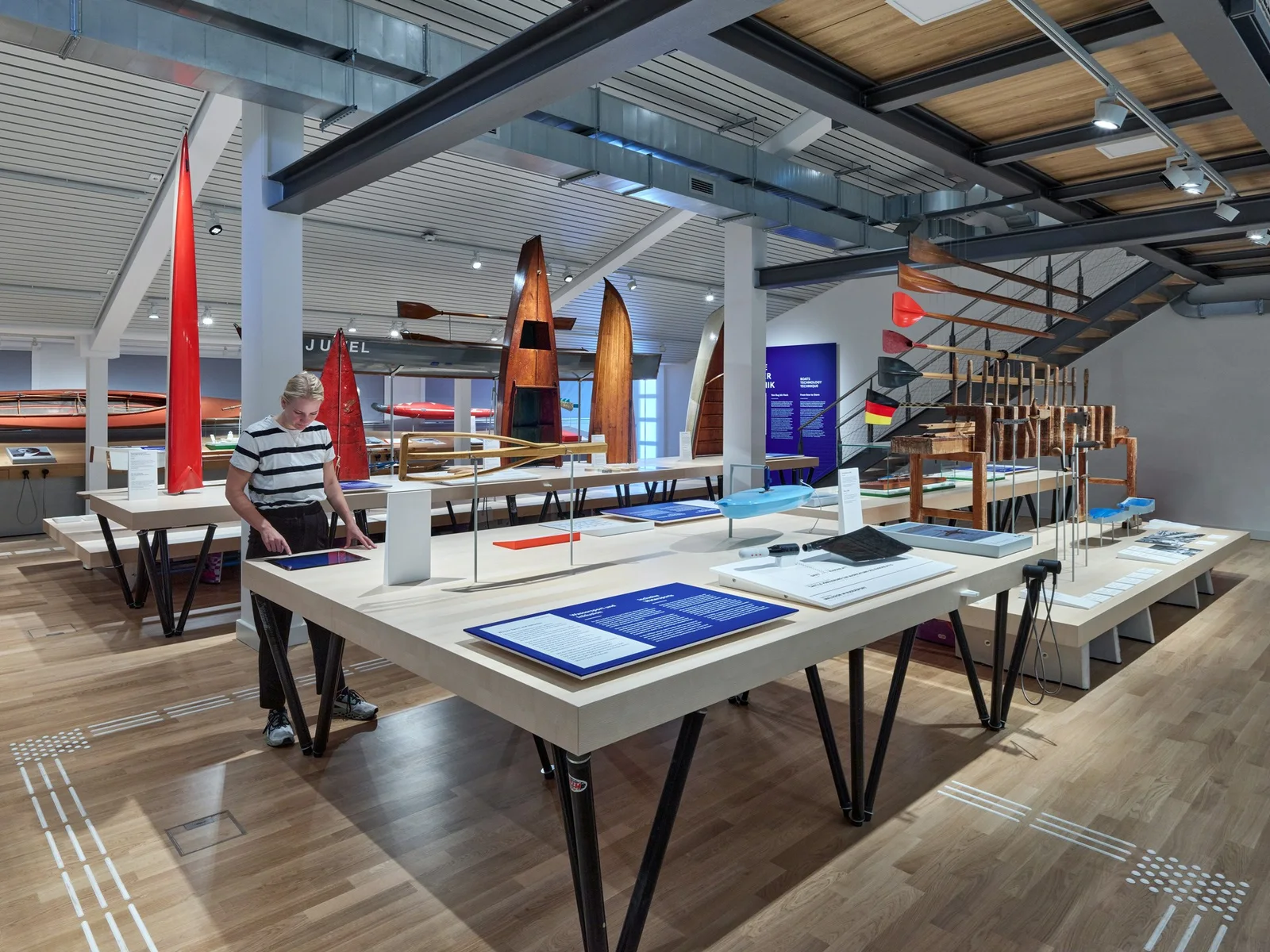 Wassersportmuseum Grünau: historic boats and paddles displayed in the modern museum hall