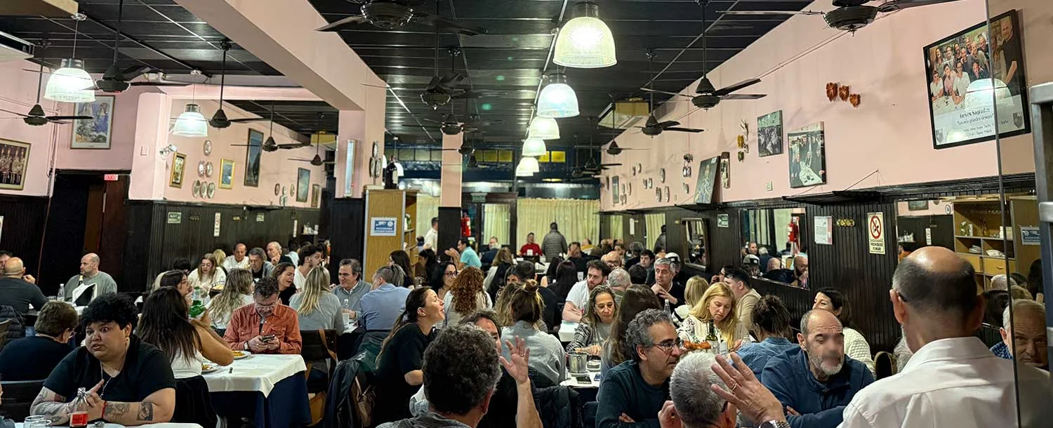 A lively dining room lined with photographs at Albamonte Ristorante