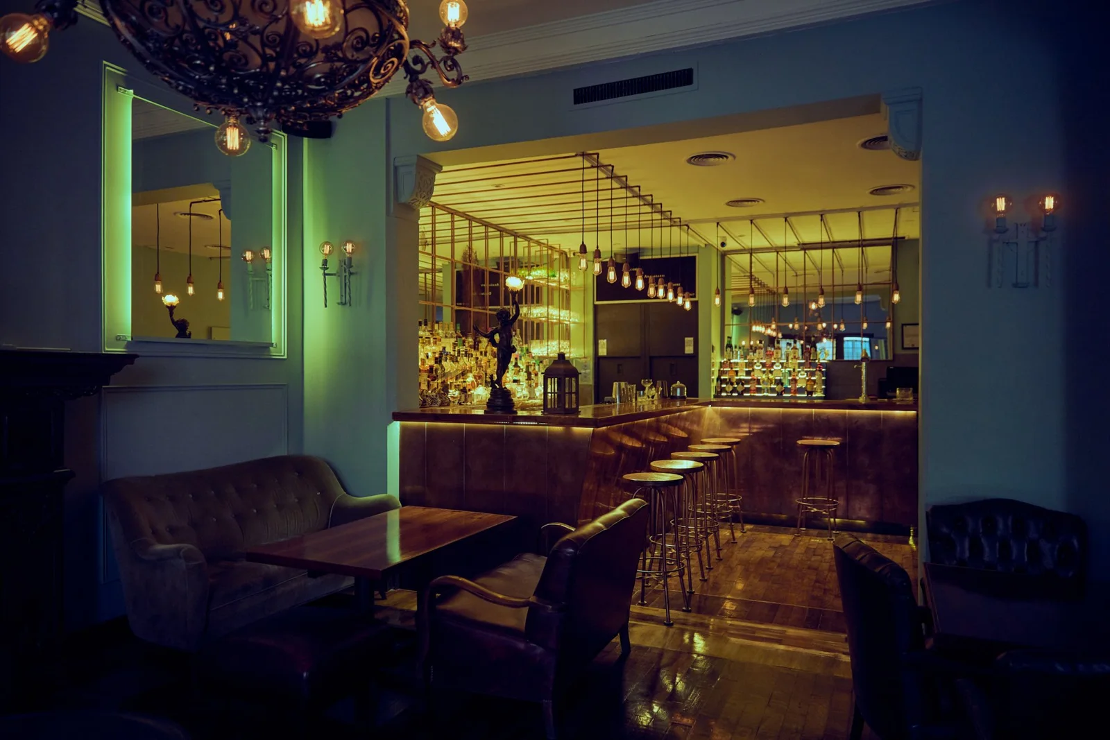 Anasagasti: the lounge and bar with warm lighting and upholstered seating