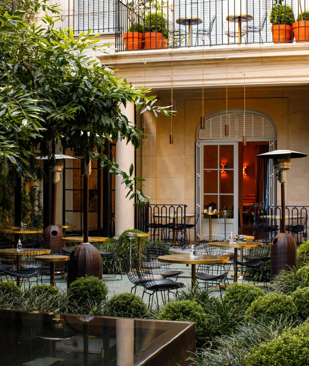 The planted courtyard and historic house at Casa Cavia