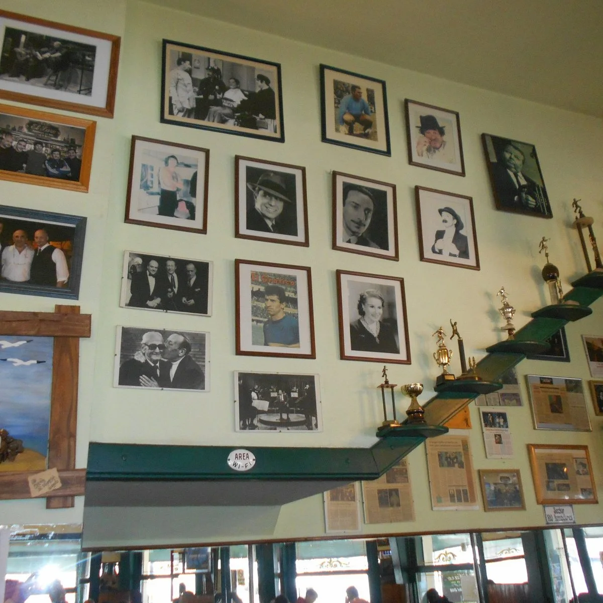 El Faro: the historic bar interior lined with framed photographs