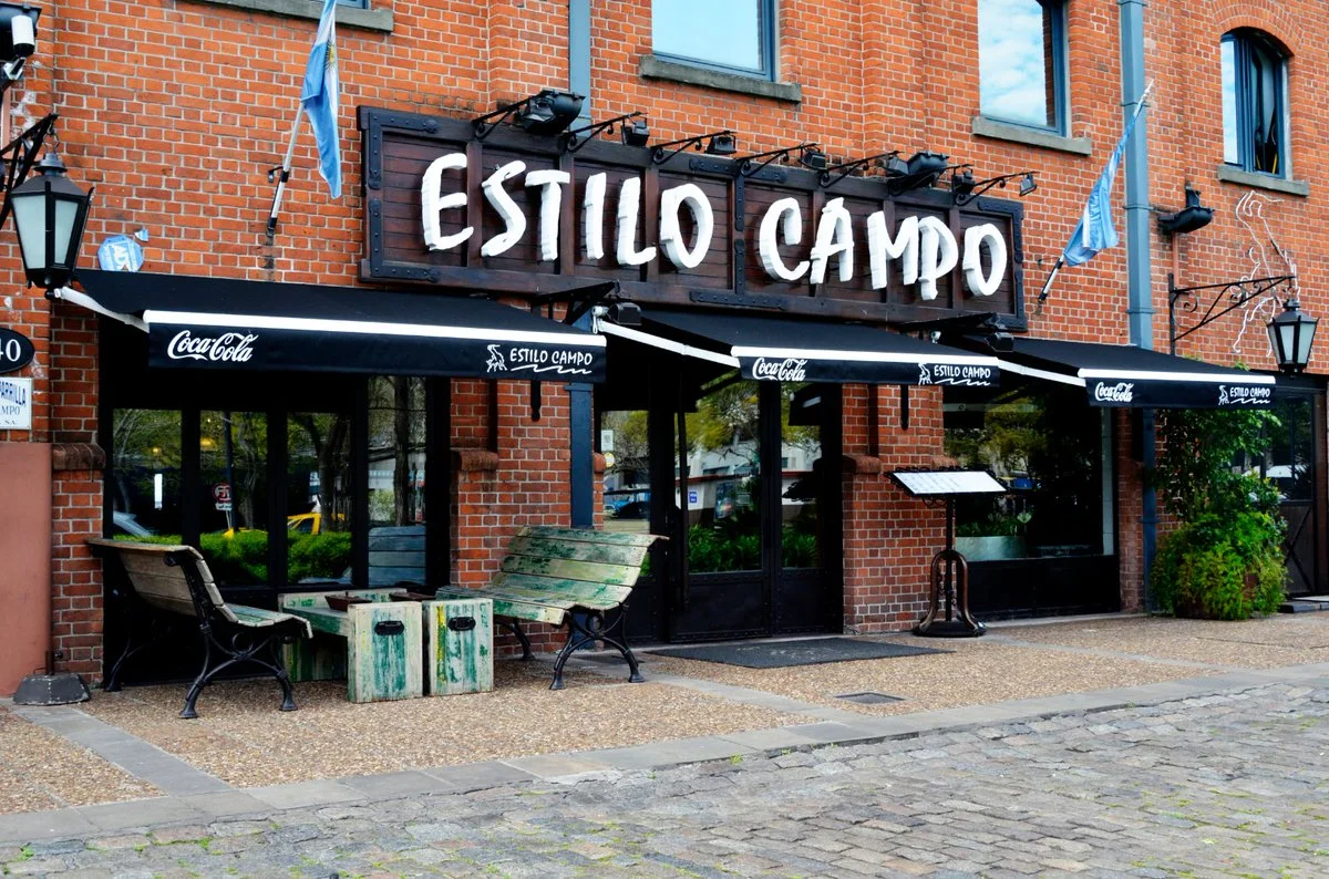 Estilo Campo: the brick restaurant facade and signed entrance