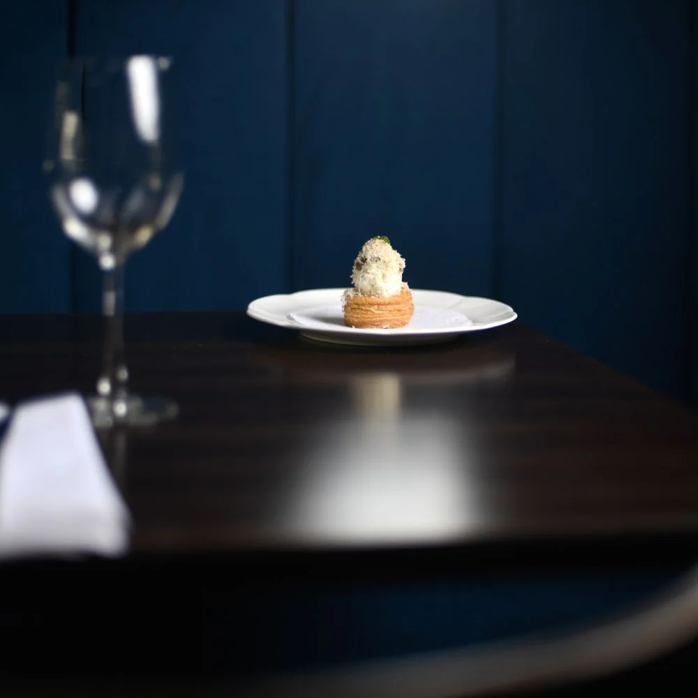 FICO: small plated dish on a dining table