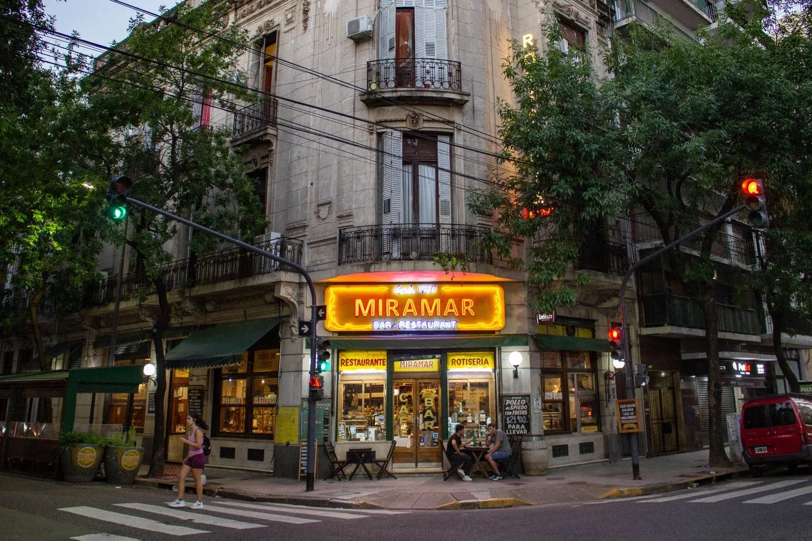 Miramar: the restaurant's glowing corner entrance beneath a historic apartment building