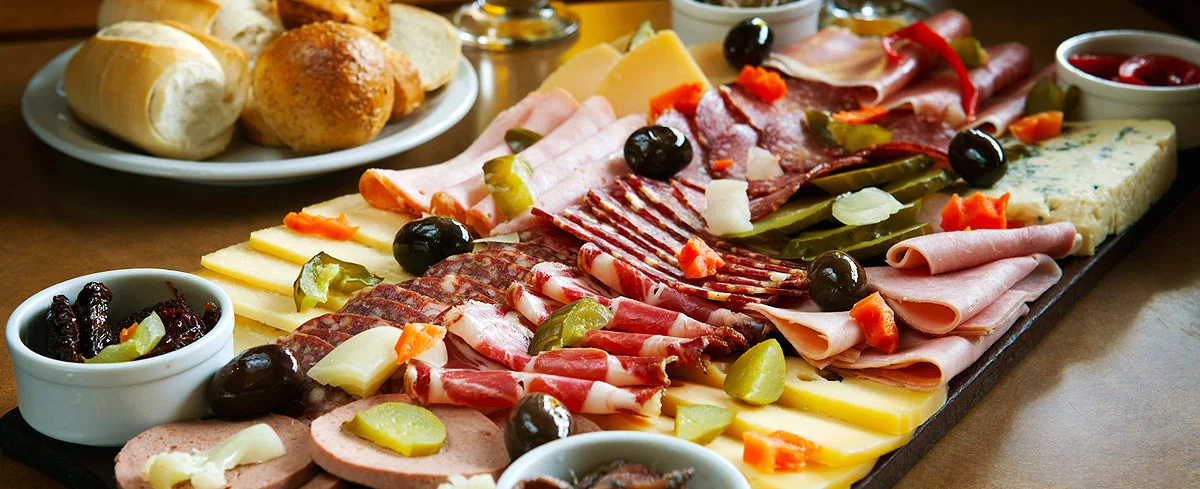 Café Ocho Esquinas: a board of cheeses, cured meats and olives, pictured by the listed source