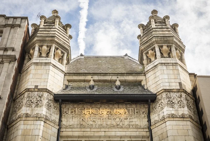 Carved stonework around the entrance at Bishopsgate Institute