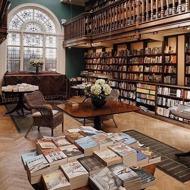Daunt Books Marylebone: bookshop shelves and arched window