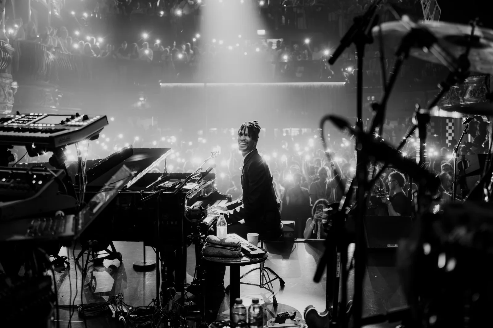 KOKO: a pianist on stage with the audience beyond, shown on its official website