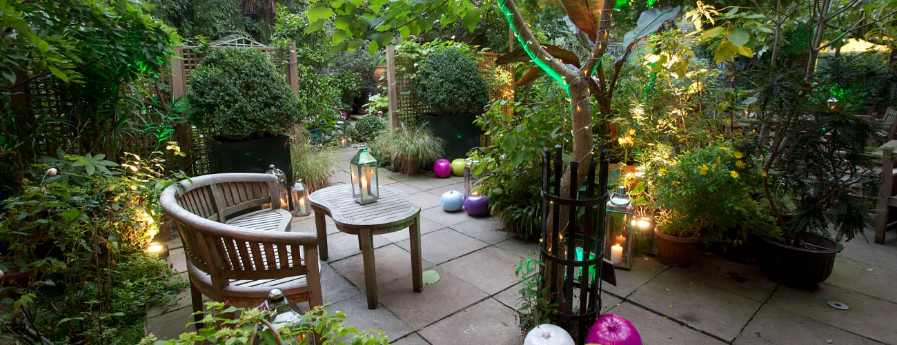 A secluded garden with outdoor seating at Museum of Brands