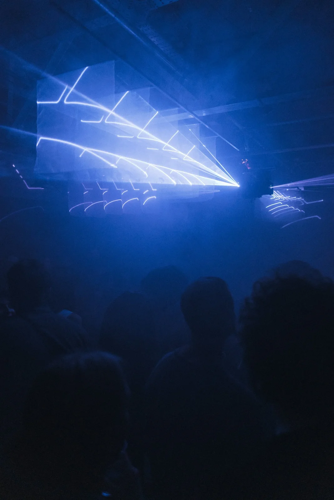 Blue laser installation above the dance floor at Ormside Projects, London