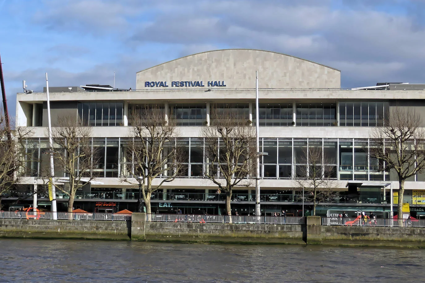 Royal Festival Hall: the concert hall's long glass facade seen across the Thames