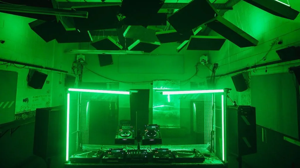 Green light around the DJ booth at Venue MOT, London