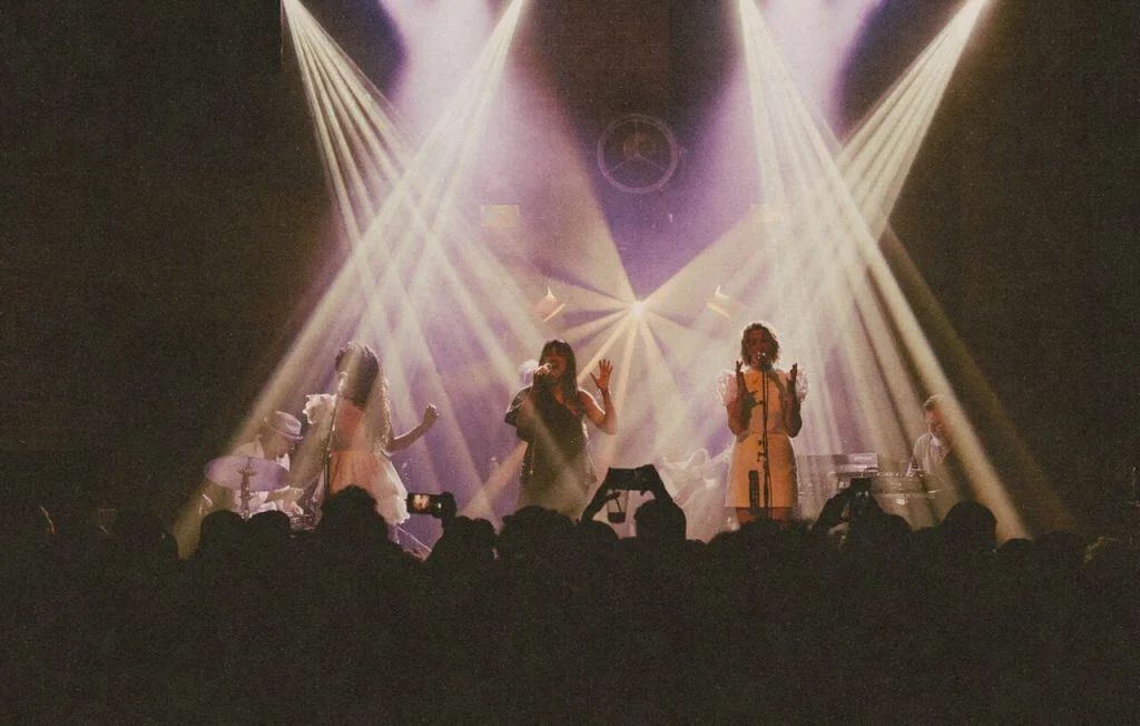 Village Underground: musicians on stage beneath intersecting beams of light, shown on its official website