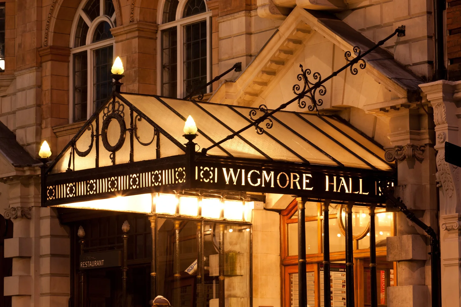 Wigmore Hall: the illuminated entrance canopy and ornamental stone facade