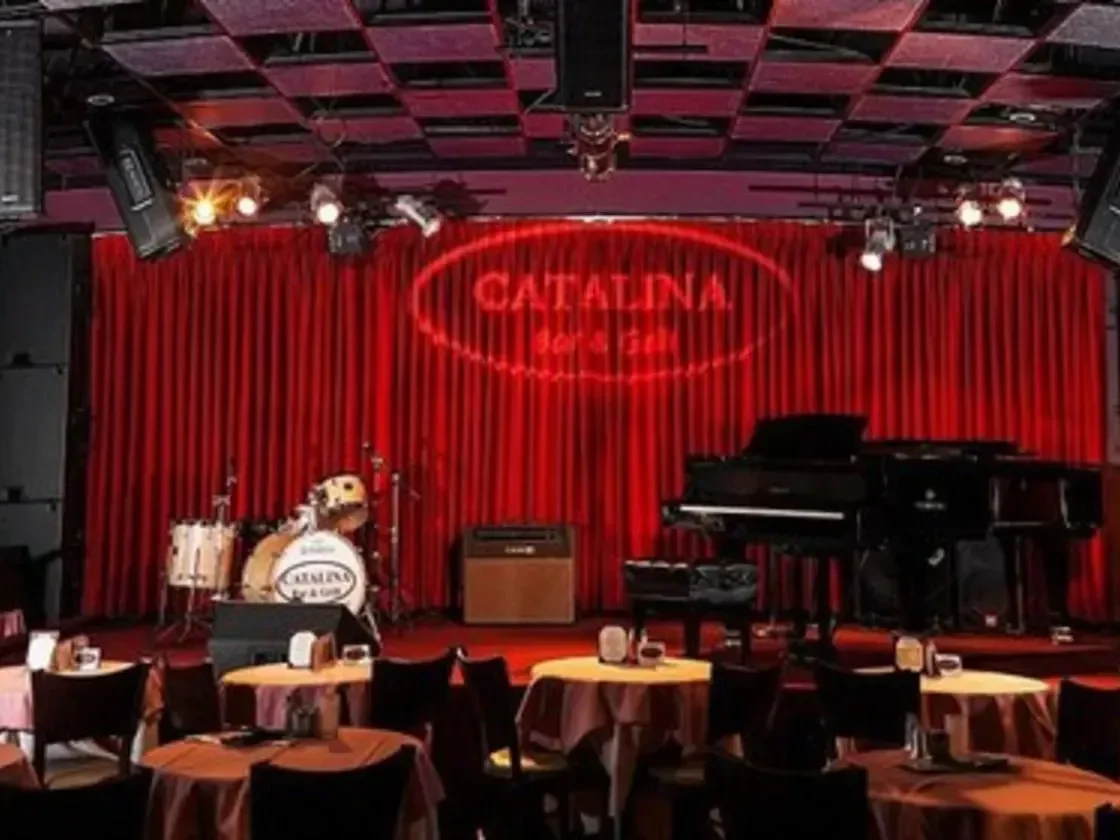 The jazz club stage, piano and red curtains at Catalina Jazz Club
