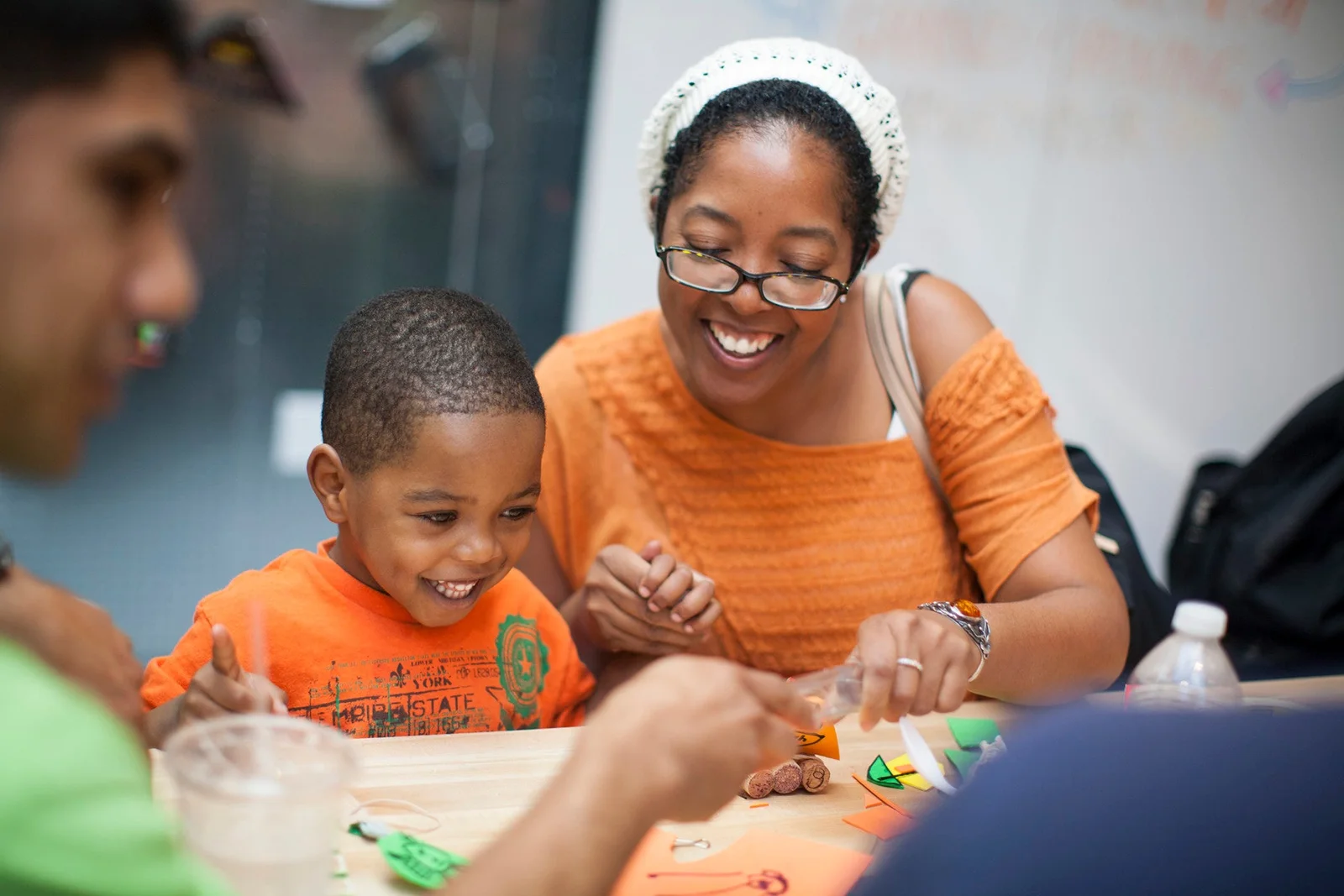 A child and adult taking part in a museum activity at Kidspace Children's Museum