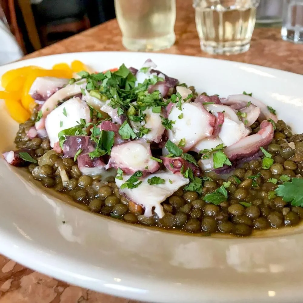 Maccheroni Republic: sliced seafood and herbs served over lentils, pictured by the listed source