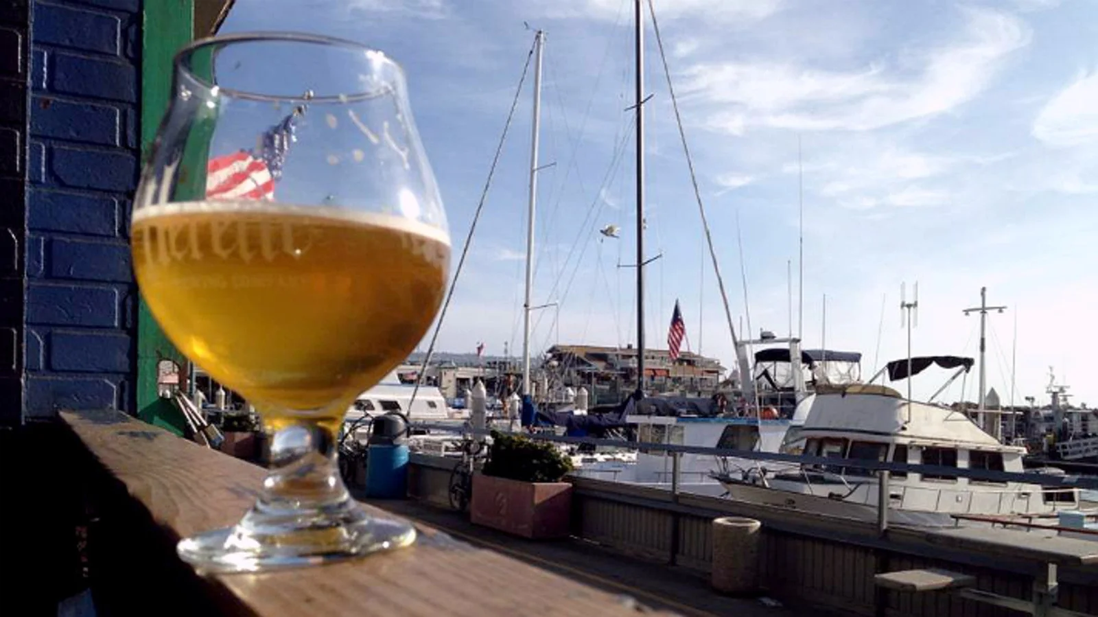 A glass of beer overlooking boats in the marina at Naja's Place