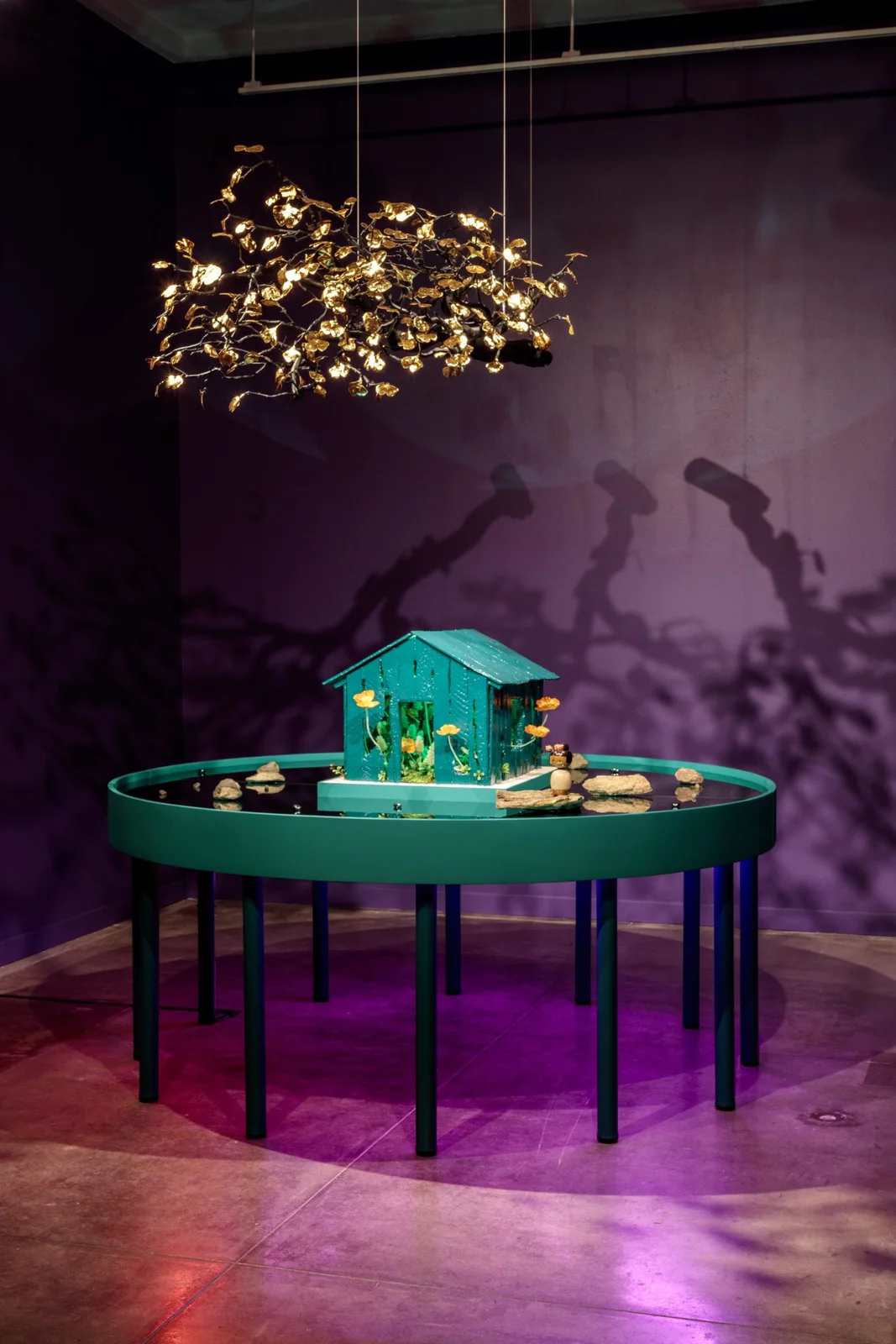 A gallery installation in a softly lit exhibition space at USC Pacific Asia Museum