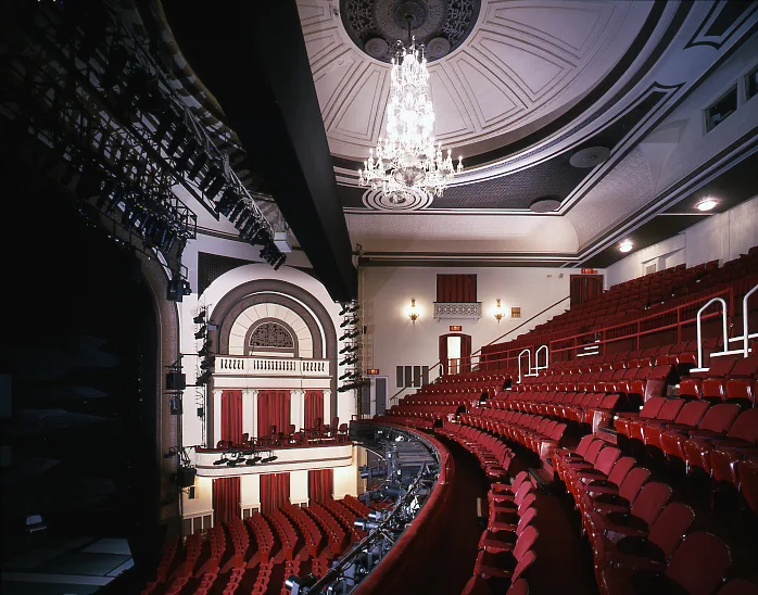 Red theatre seats beneath decorated balconies at Ethel Barrymore Theatre