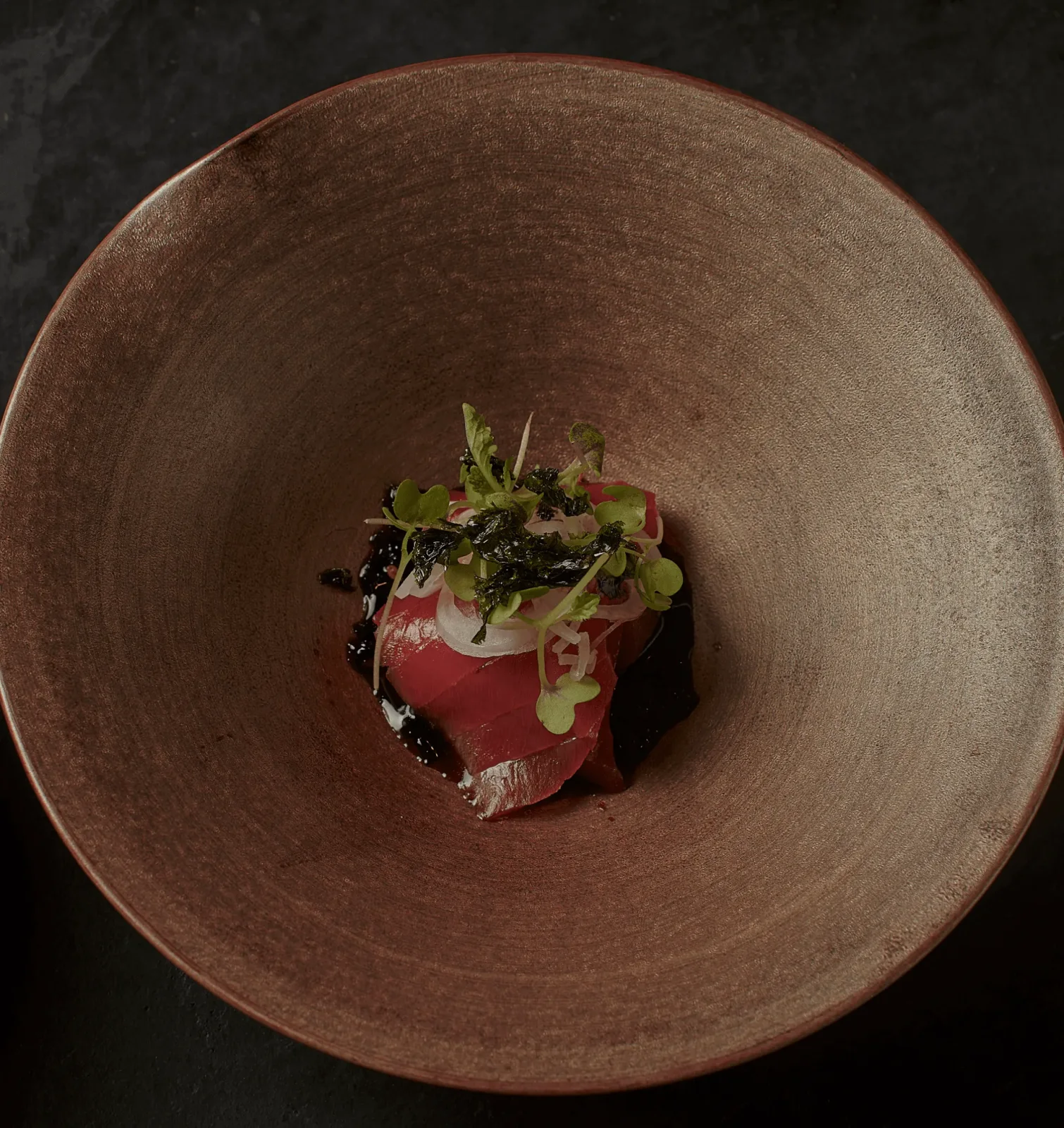 Ito: a small dish in a broad ceramic bowl, shown on its official website