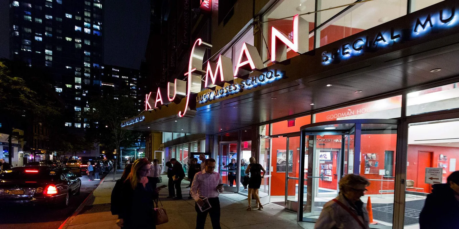 The illuminated Kaufman Music Center entrance at Merkin Hall