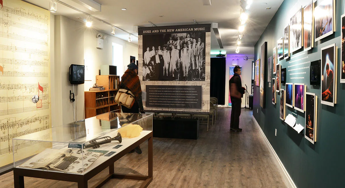 Museum display cases and photographs of jazz musicians at National Jazz Museum in Harlem