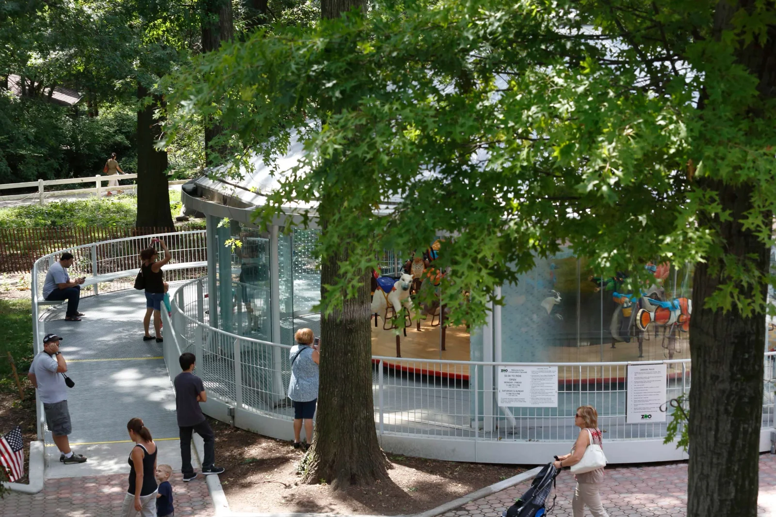 Staten Island Zoo: the zoo's glass-sided carousel pavilion beneath leafy trees