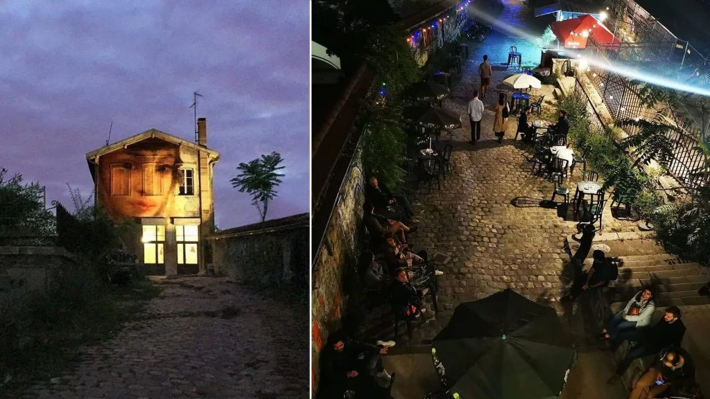 La Gare / Le Gore: the former station building and lively outdoor terrace at night