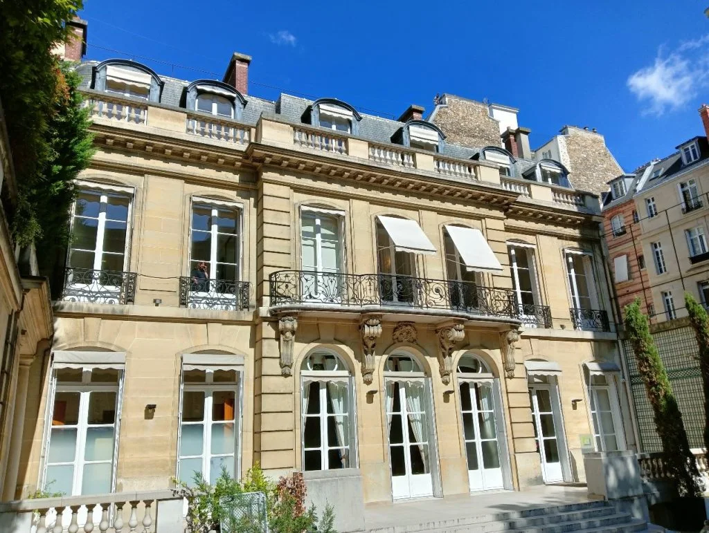 The museum’s stone facade and entrance at Musée de la Contrefaçon