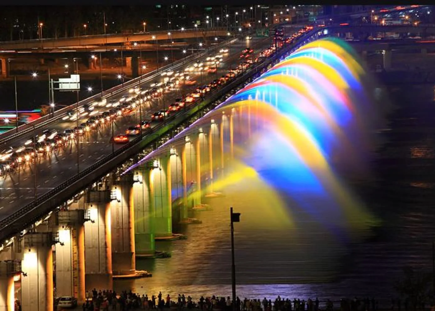 The bridge's illuminated fountains spilling into the river at Banpo Moonlight Rainbow Fountain