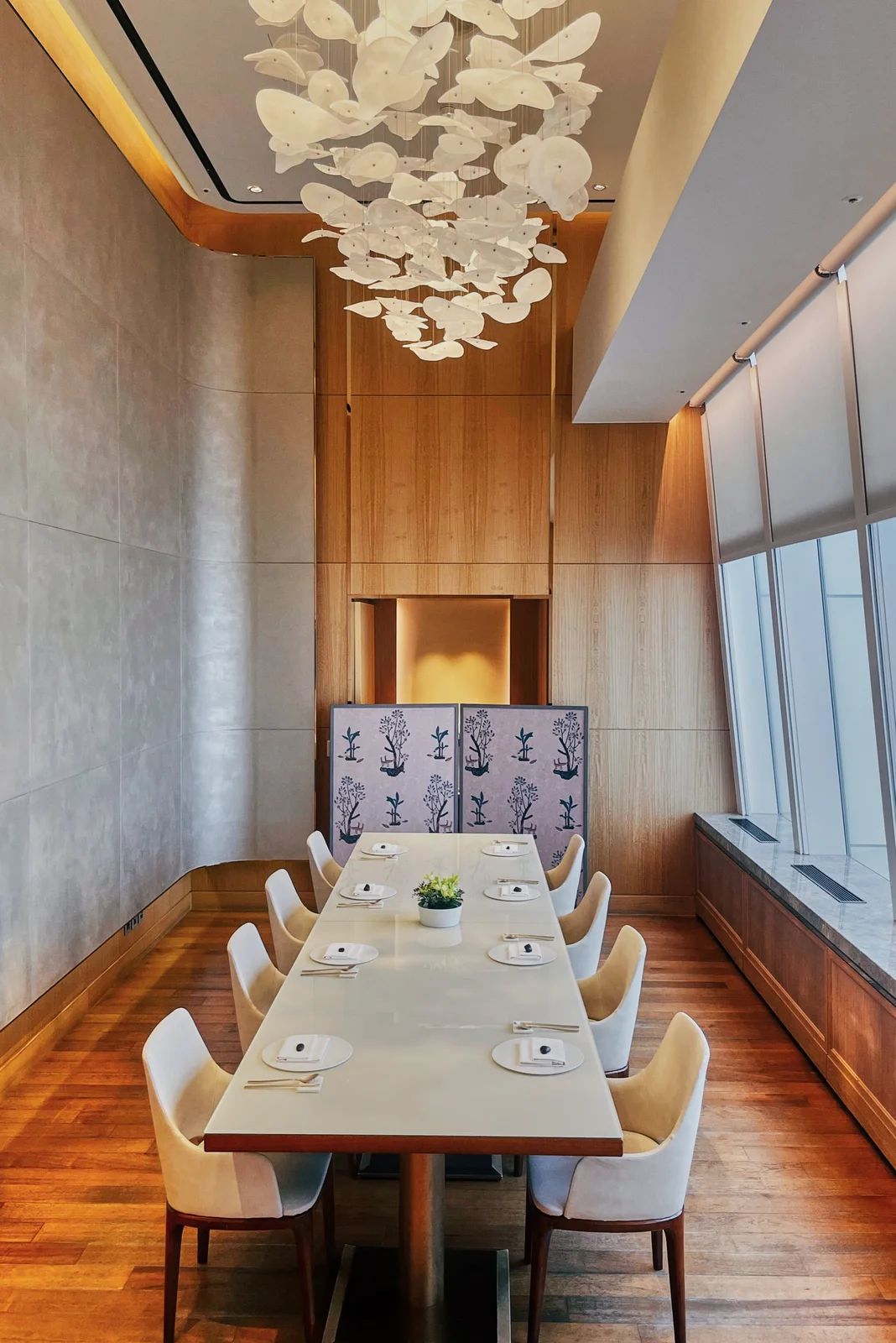 The restaurant’s private dining room beside tall windows at Bicena