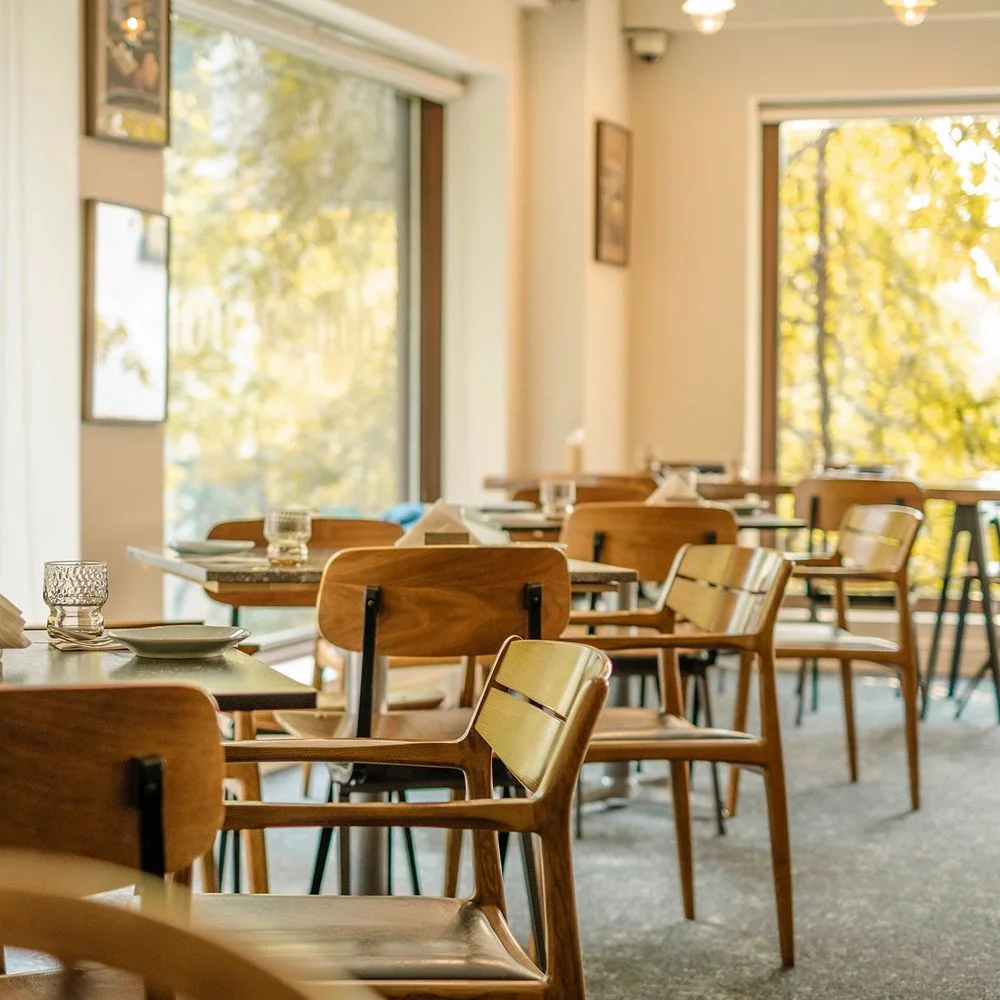 Doughroom: bright dining room with wooden chairs