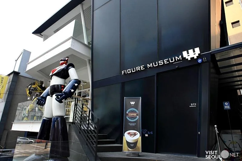 Figure Museum W: museum facade and large character statue